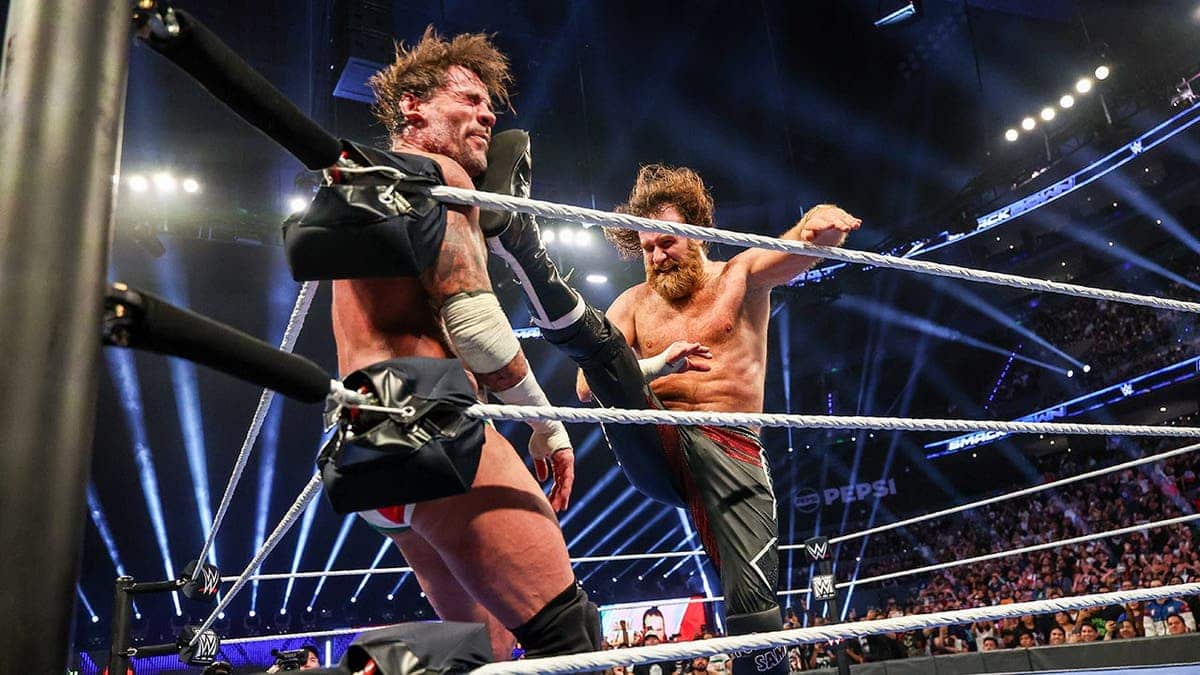 Sami Zayn delivers a Helluva Kick to CM Punk during wrestling match.