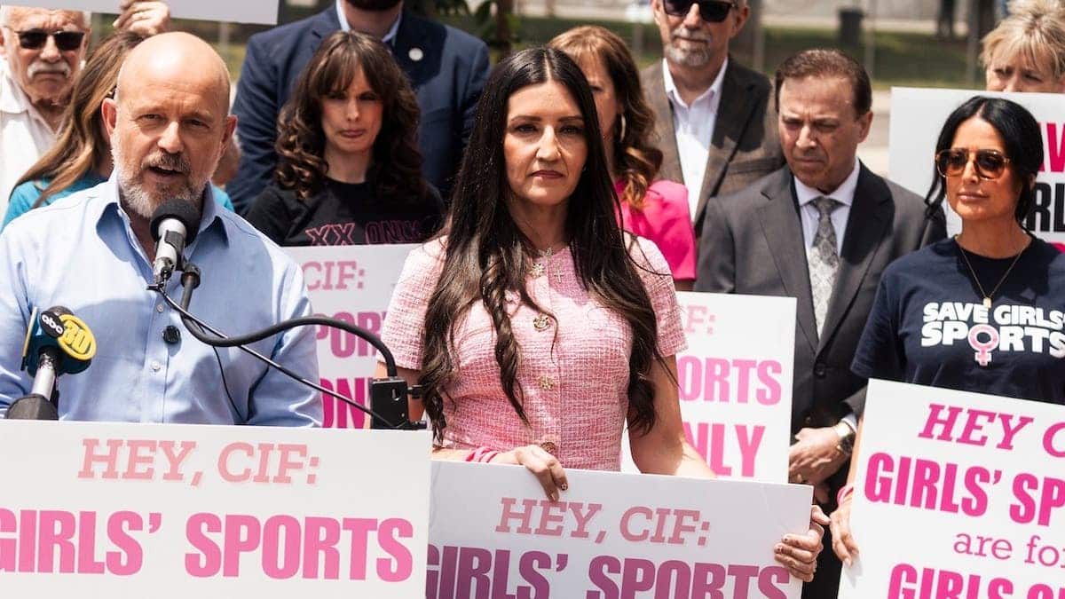 Steve Hilton and Sonja Shaw stand at a news conference outside Veterans Memorial Stadium in Clovis.
