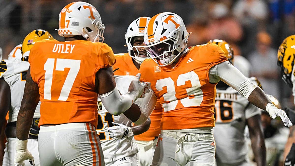KNOXVILLE - Tennessee Volunteers defensive lineman Jordan Norman (33) and Tennessee Volunteers defensive lineman Ethan Utley (17) celebrate a stop during the college football game between the Tennessee Volunteers and the Kennesaw State Owls on September 19, 2026, at Neyland Stadium.
