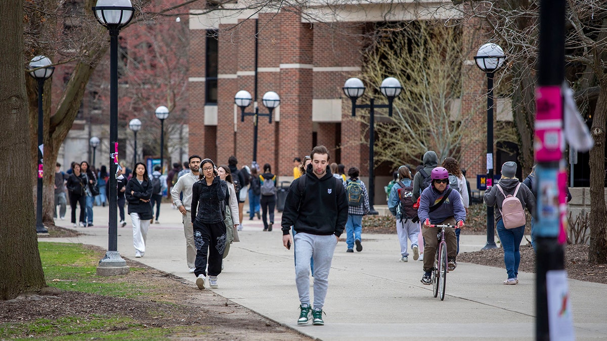 niversity of Michigan students walk on the UM campus on April 3, 2025 in Ann Arbor, Michigan. (Photo by Bill Pugliano/Getty Images)