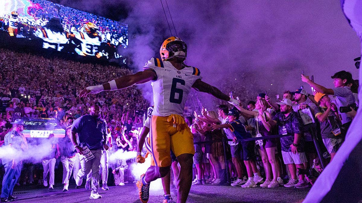 Winston Watkins Jr. walks out of the tunnel before the game at Tiger Stadium.