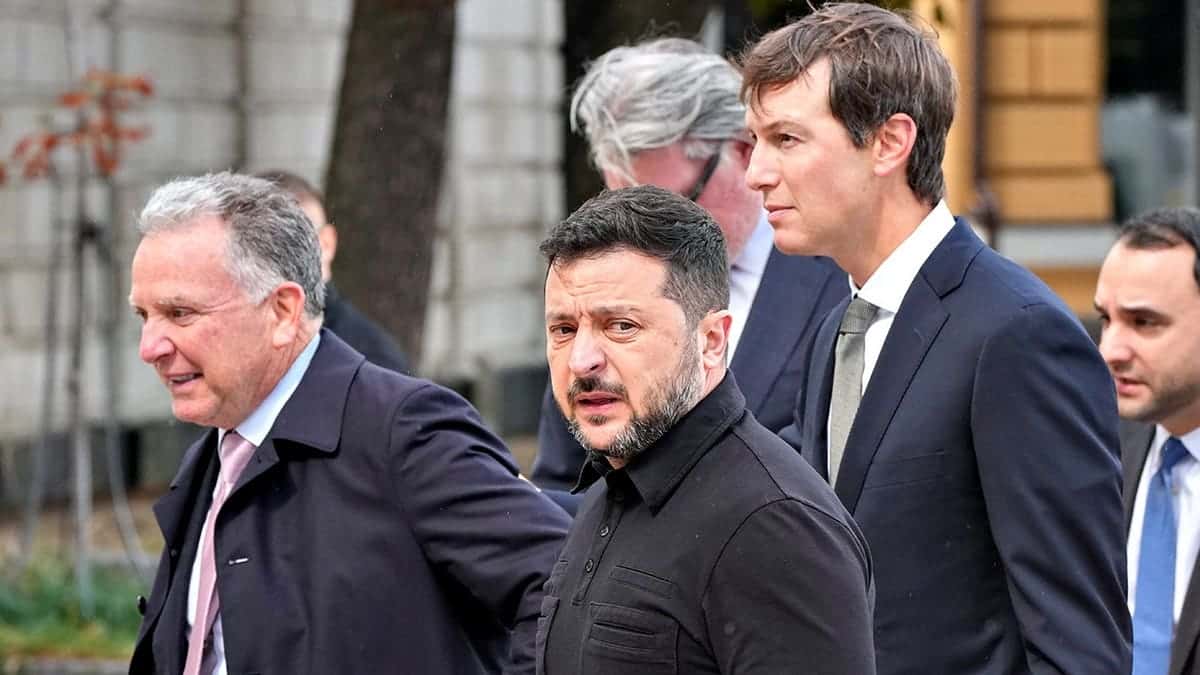 Volodymyr Zelenskyy walks with Jared Kushner and Steve Witkoff in Kyiv.