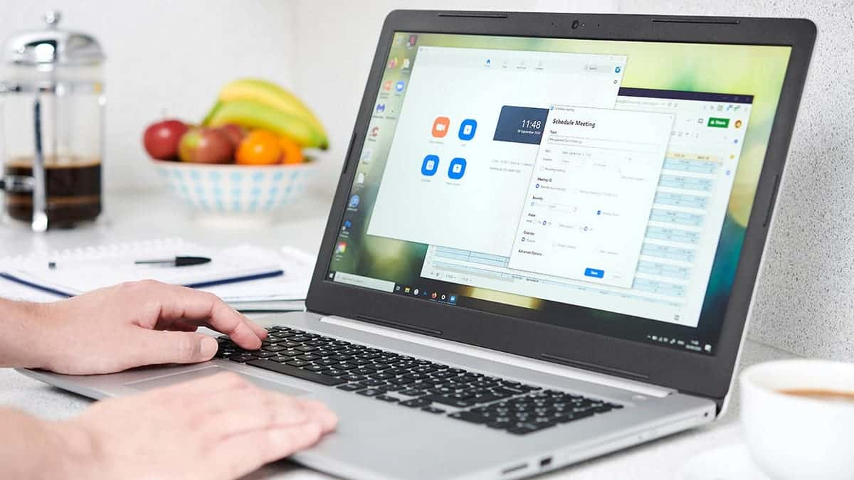 Person typing on their laptop.