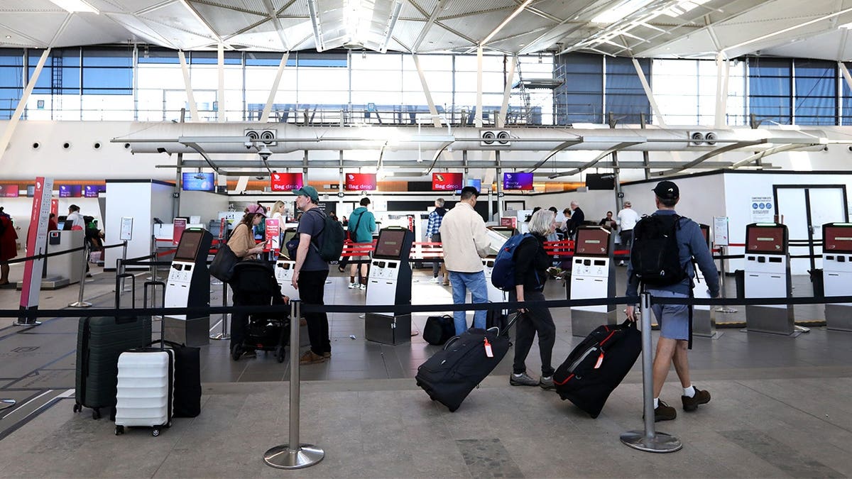 Travelers walking around Sydney Airport