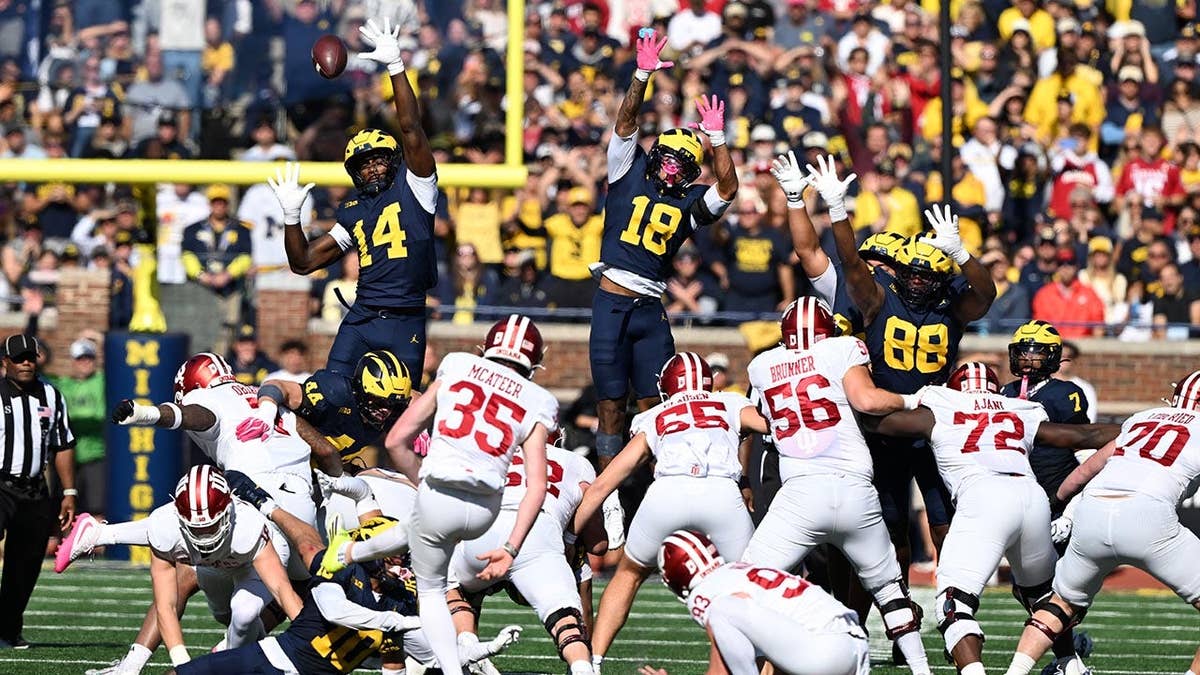 Paddy McAteer kicking a field goal during a college football game