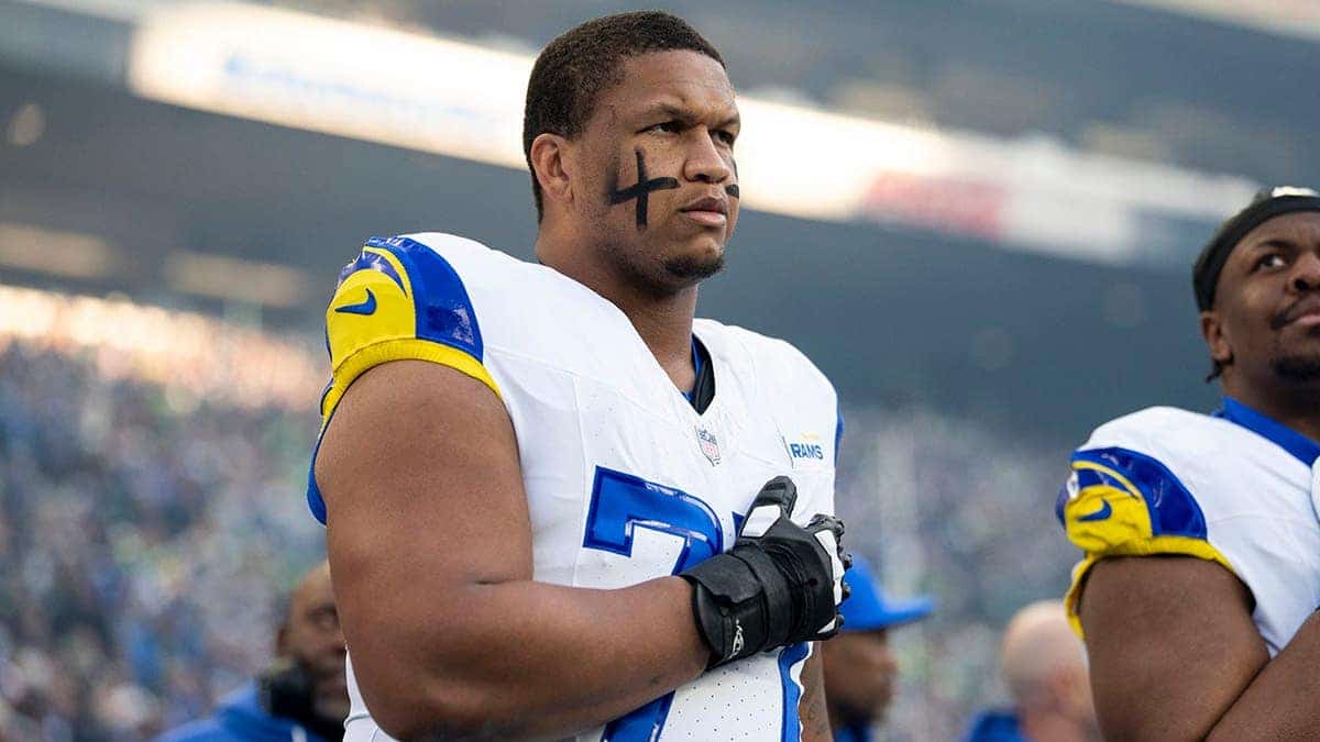 Alaric Jackson #77 of the Los Angeles Rams looks on during the national anthem at Lumen Field.