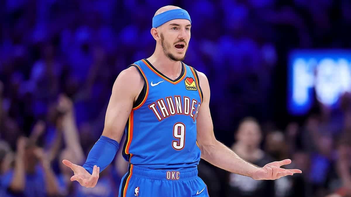 Alex Caruso shooting a three-point basket during an NBA game.