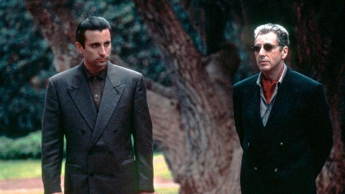Andy Garcia and Al Pacino stand on the set of The Godfather: Part III.