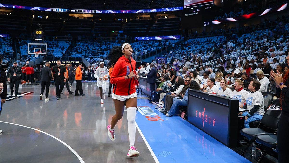Angel Reese runs off the court at State Farm Arena.