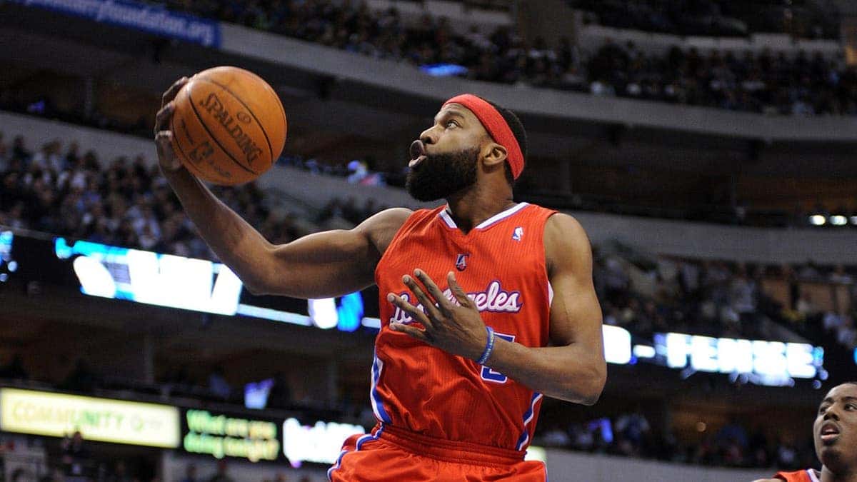 Baron Davis dribbles during an NBA game at the American Airlines Center in Dallas.
