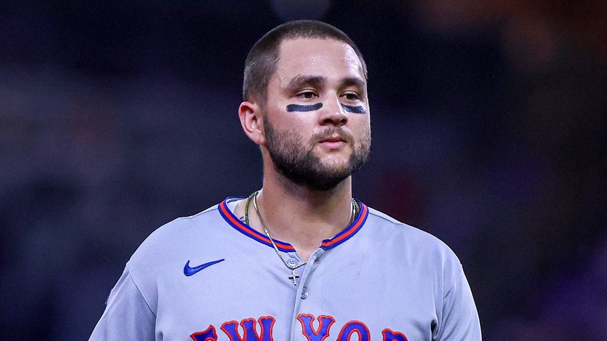 Bo Bichette stands on the field during a New York Mets game at Truist Park.