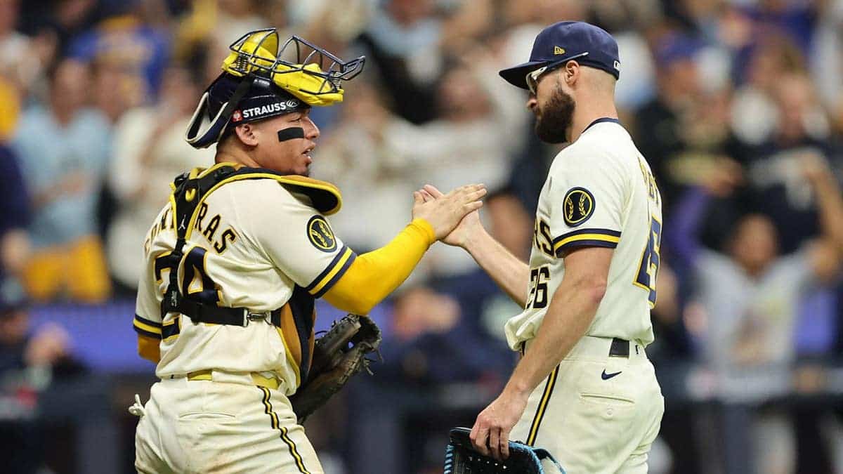 William Contreras and Aaron Ashby of the Milwaukee Brewers celebrate after winning Game 2 of the 2026 World Series.