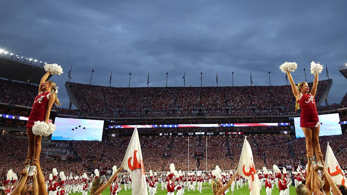 Bryant-Denny Stadium interior during national anthem before Alabama vs. Georgia football game.