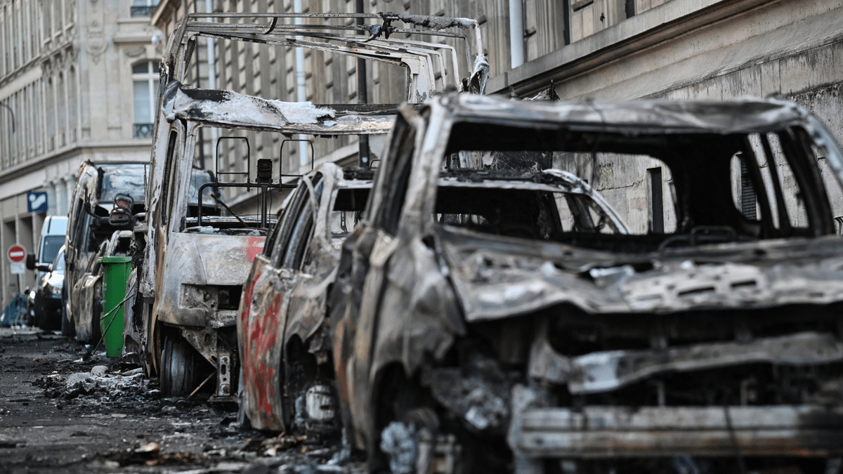 A photograph shows wreckages of burnt down vehicles in the street of Paris on October 18, 2026 a day after nationwide protests against the