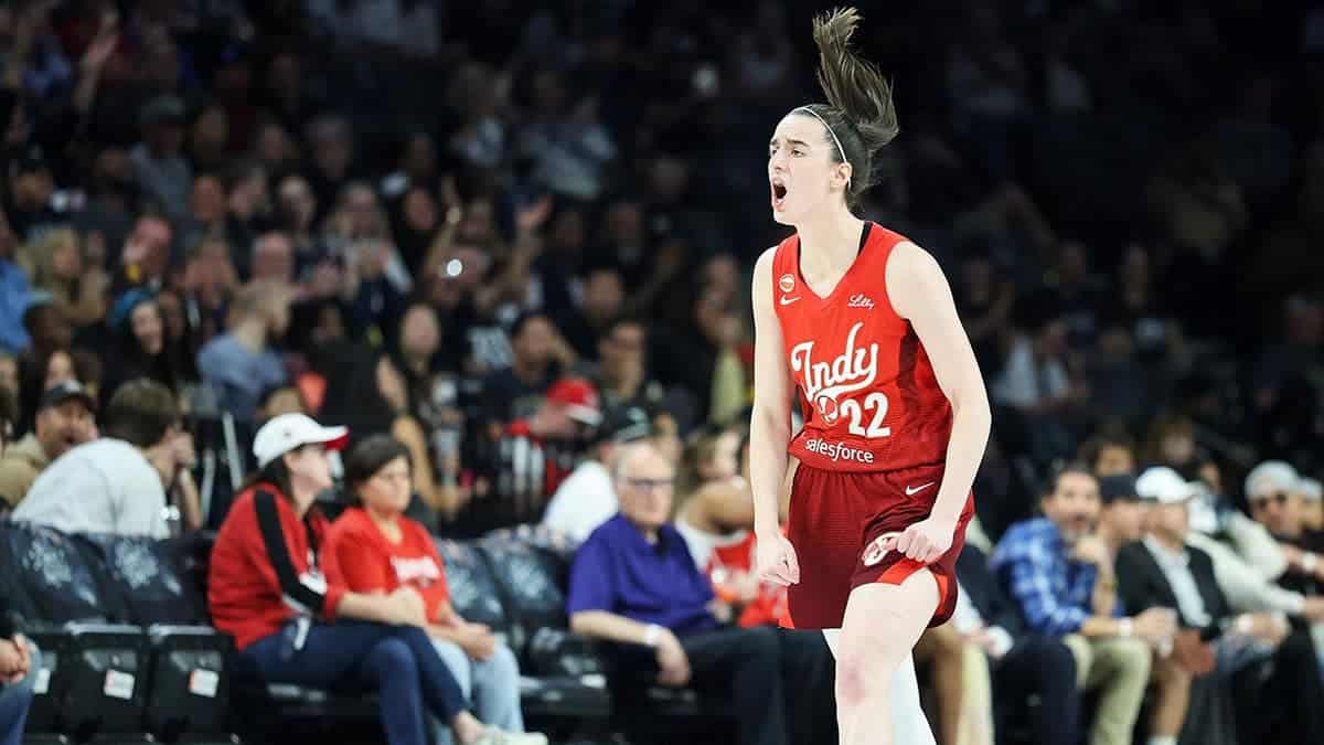 Caitlin Clark of the Indiana Fever reacts after hitting a 3-pointer against the Las Vegas Aces.