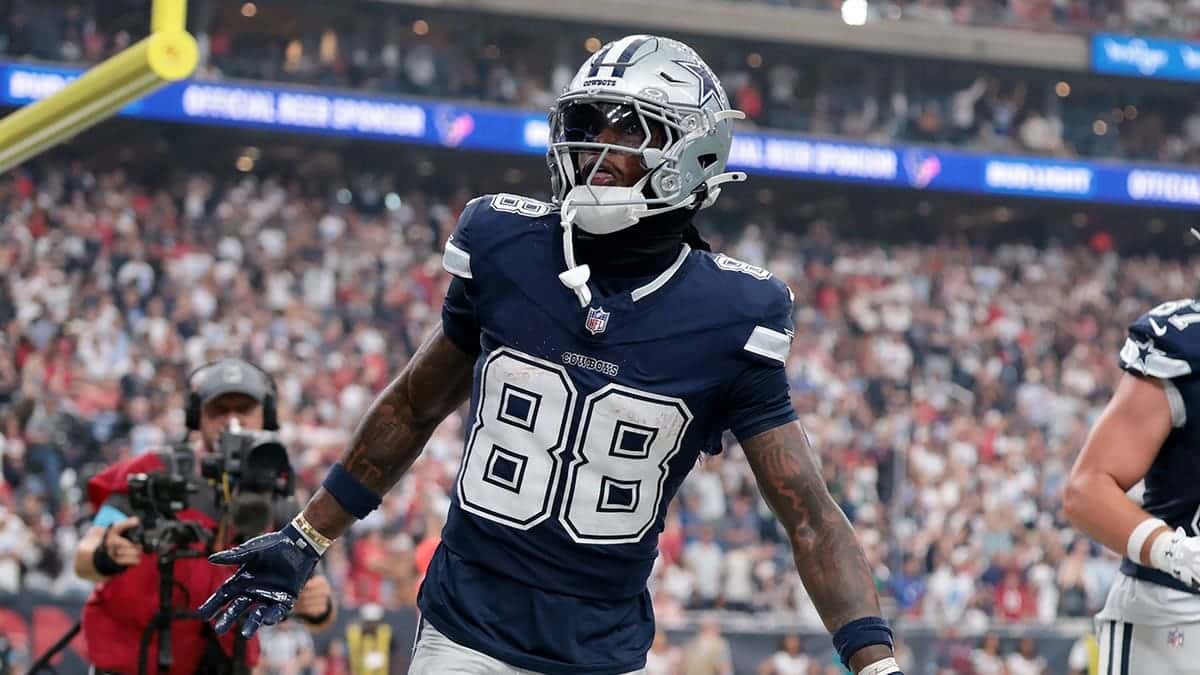 Ceedee Lamb #88 celebrates after scoring a touchdown at NRG Stadium.