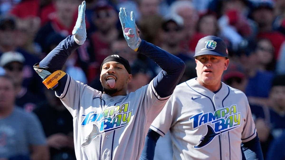 Chandler Simpson celebrates after hitting a two-run triple.