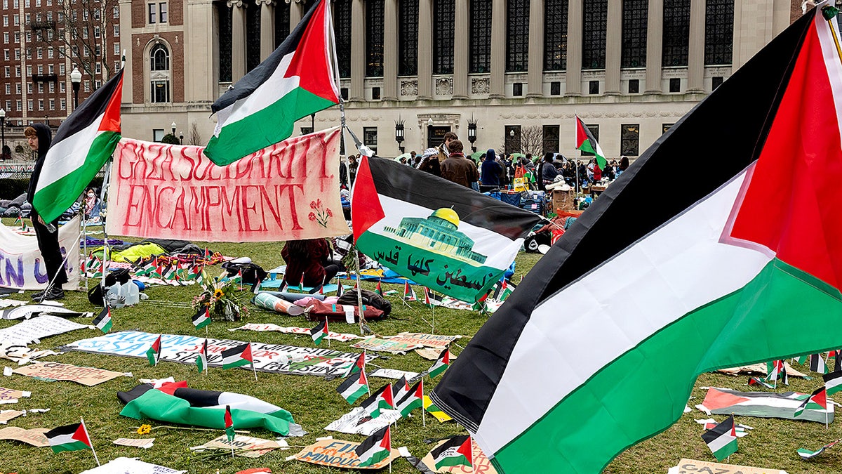 Anti-Israel students sit and stand on Columbia University’s central lawn as part of an ongoing campus protest.