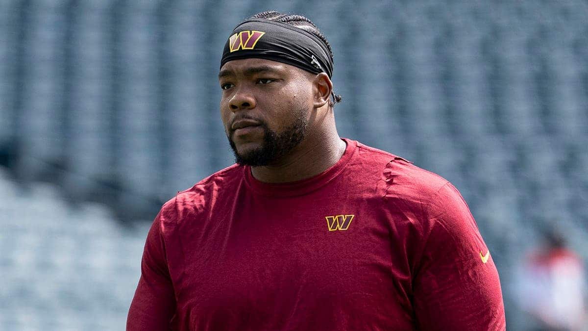 Daron Payne #94 of the Washington Commanders looks on before an NFL game.
