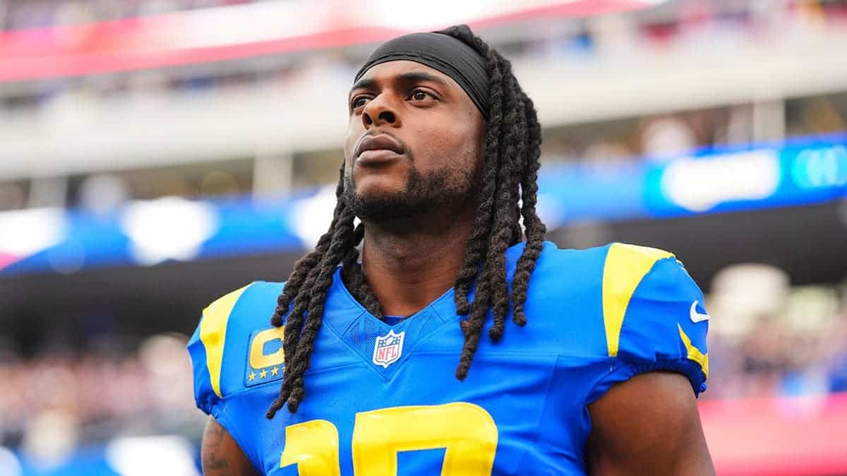 Davante Adams stands on the sideline during the national anthem at SoFi Stadium.