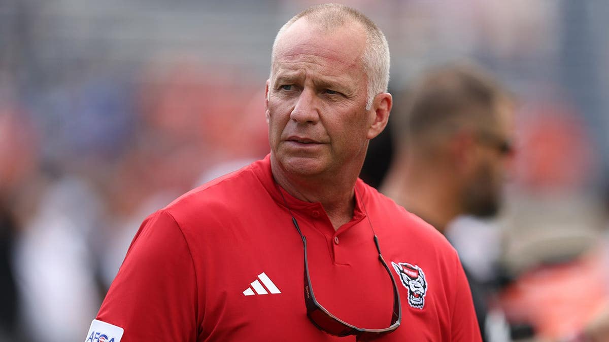 Dave Doeren, North Carolina State head coach, stands before the game at Scott Stadium.