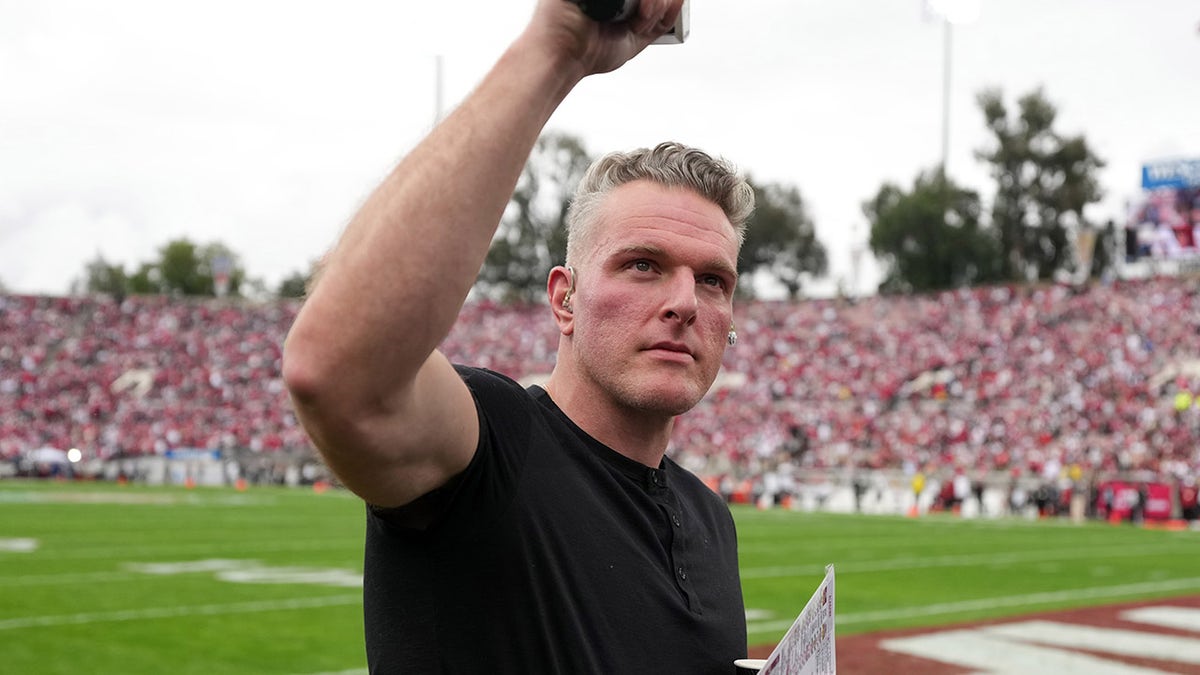 Pat McAfee waves to the crowd