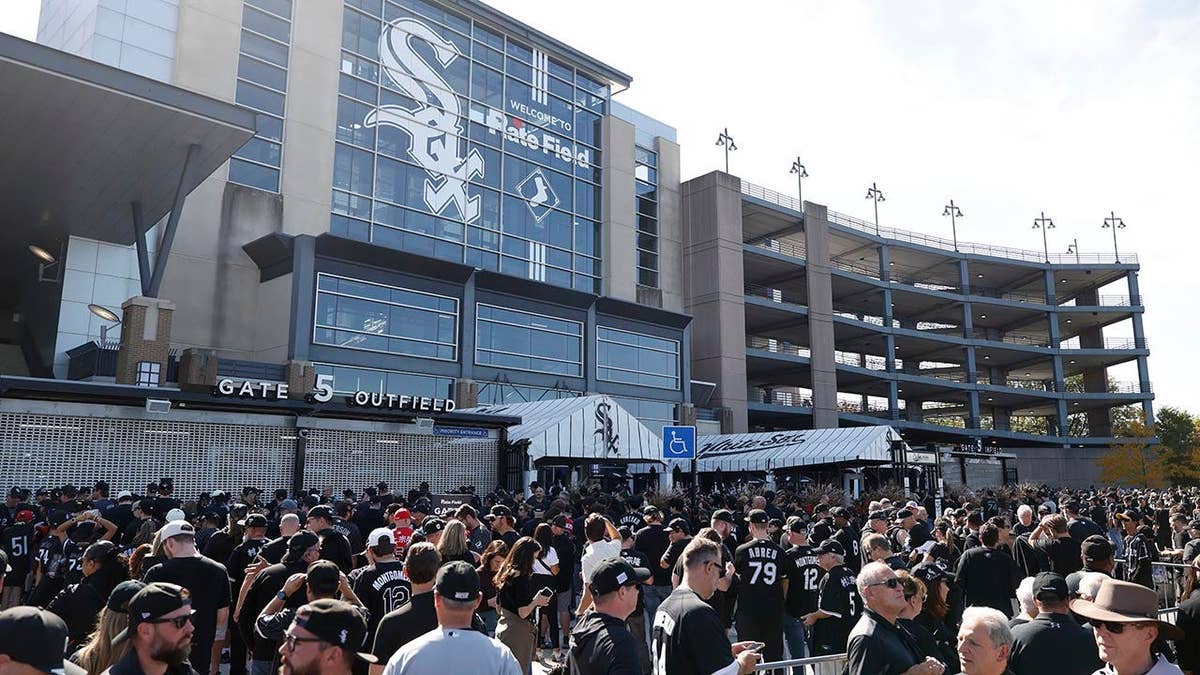 Fans arrive outside Rate Field before Game 3 of the American League Division Series.