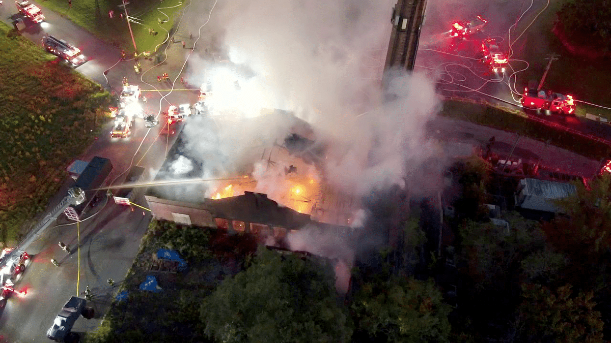 Fire crews work to control a warehouse fire