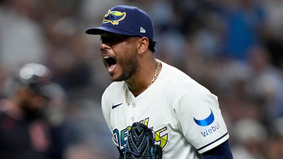 Freddy Peralta celebrates on the field after the top of the fourth inning.