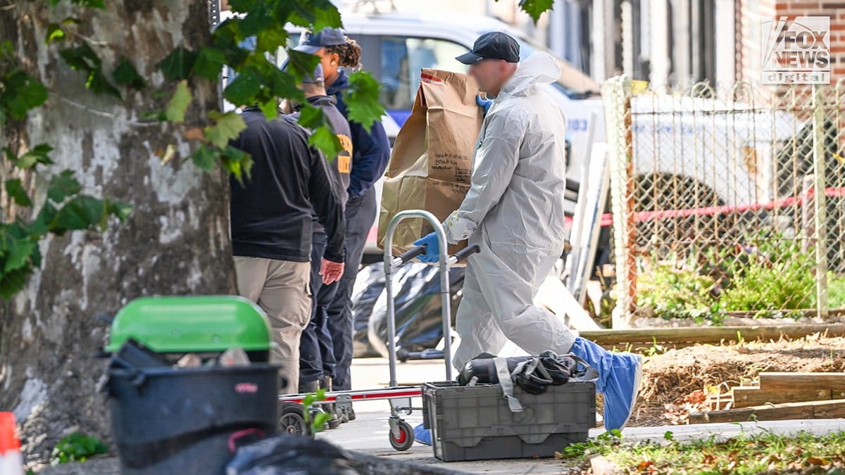 FBI agents carry evidence from Eugene Horsch's home in Philadelphia