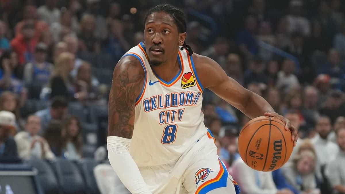 Jalen Williams drives past Darius Garland during NBA game in Oklahoma City.