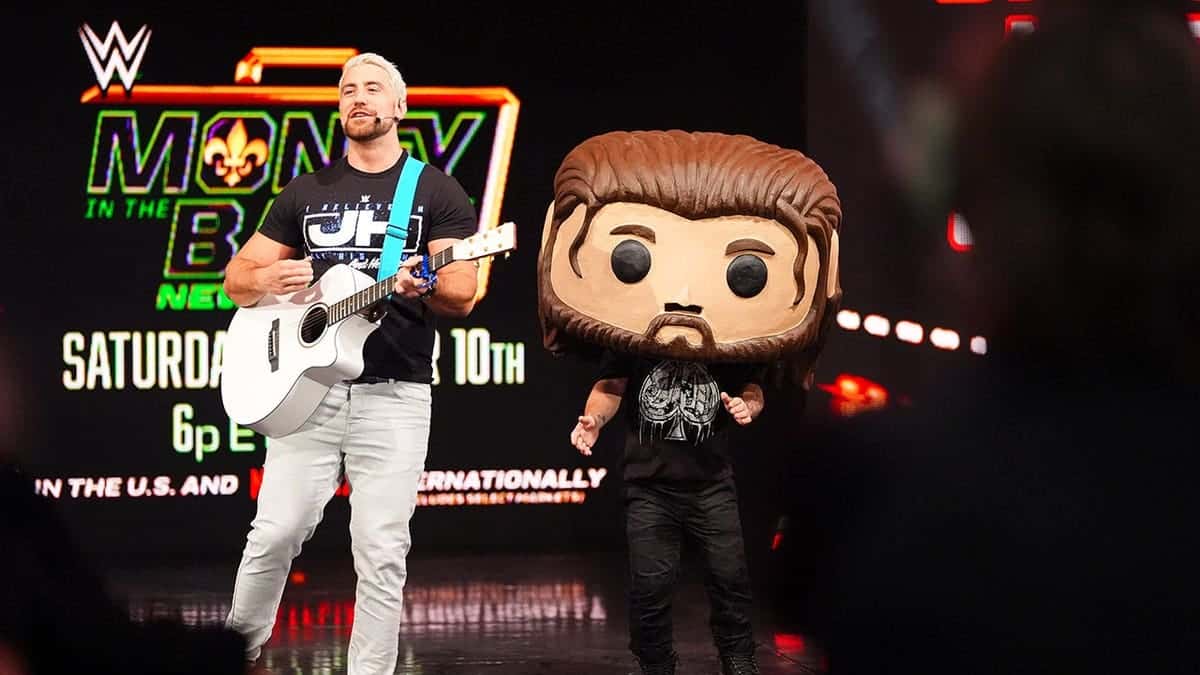 Joe Hendry sings while entering the ring at Fiserv Forum.