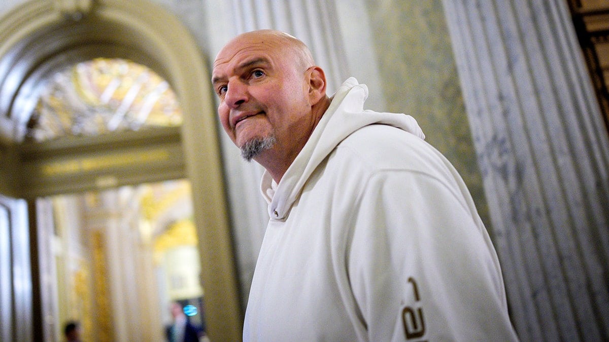 Sen. John Fetterman reacts as he arrives for votes on Capitol Hill