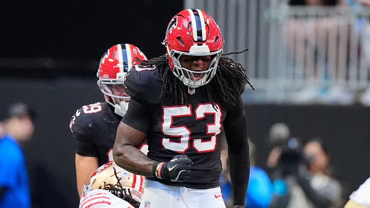 Kendal Daniels celebrates after a defensive stop during an NFL game.