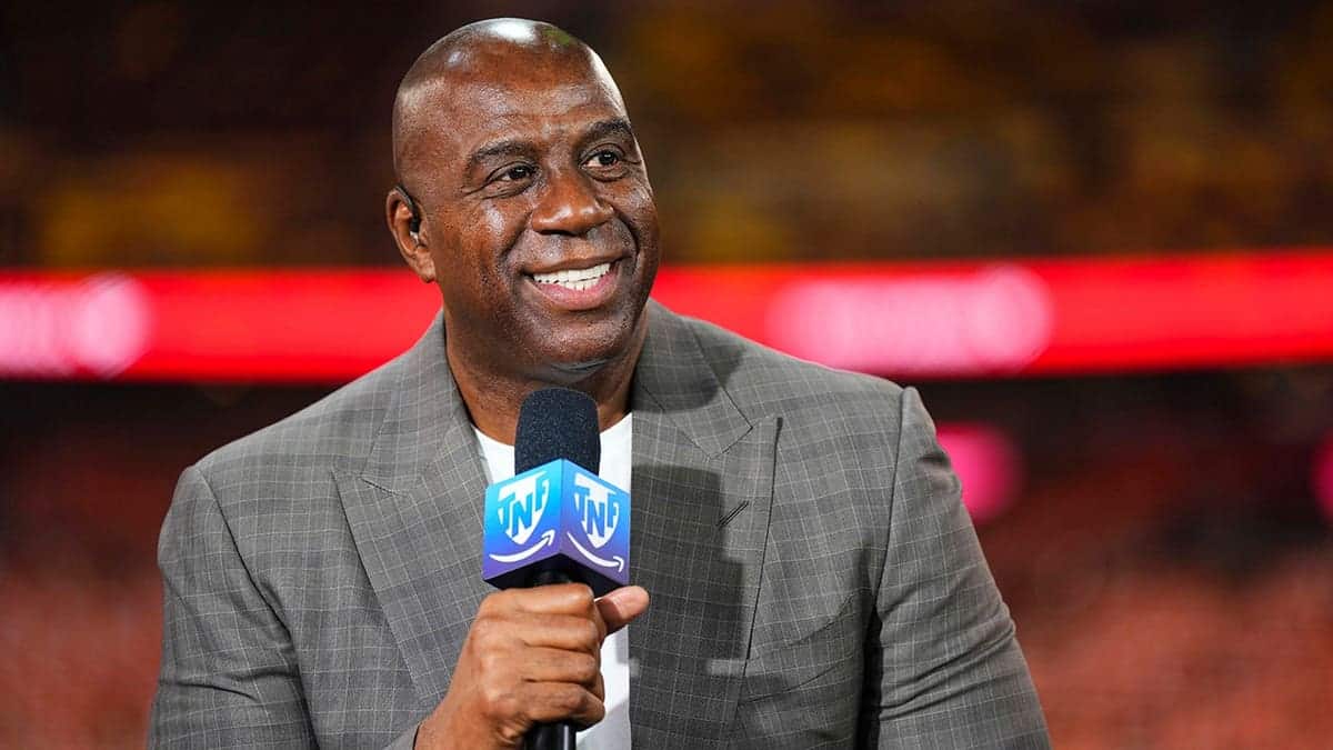 Magic Johnson stands on the set of a pregame show at FedEx Field.