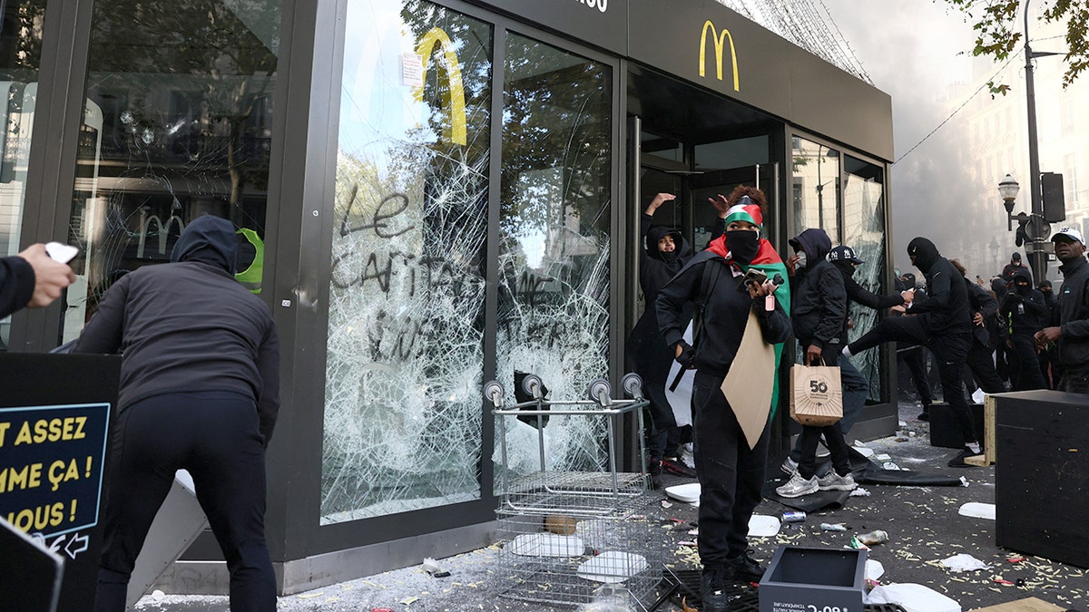 Proteters vandalize a McDonald's in Paris.