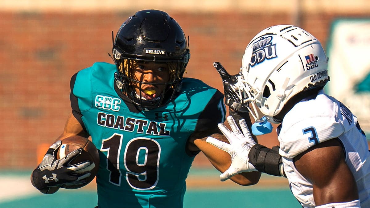 Coastal Carolina Chanticleers running back Nate Hope II (19) runs the ball against Old Dominion Monarchs safety Robert Kennedy III (3) in the fourth quarter at Brooks Stadium.
