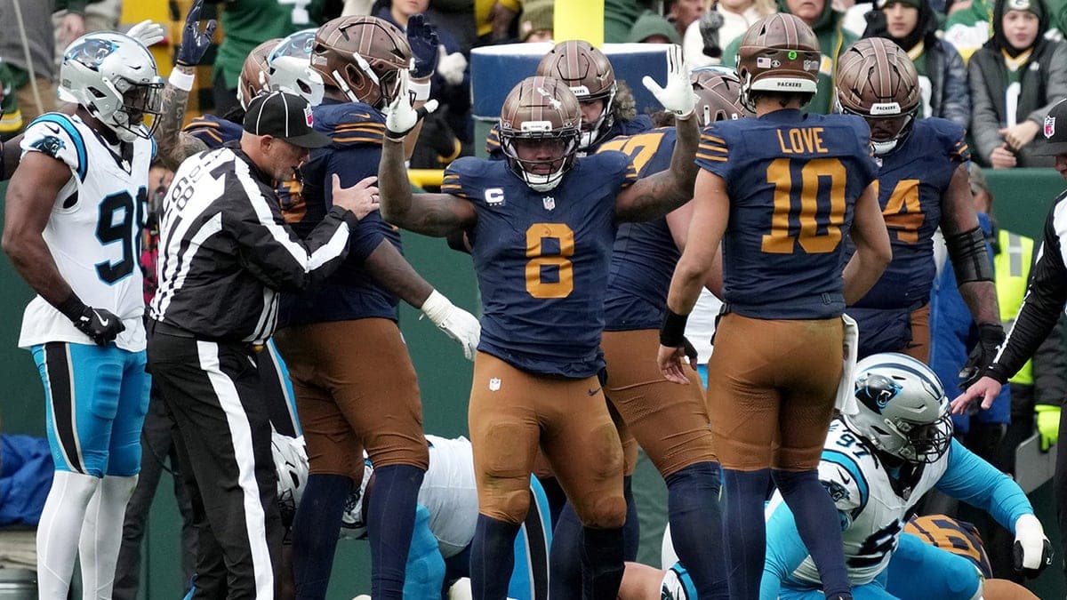 Green Bay Packers running back Josh Jacobs (8) reacts after running for a touchdown against the Carolina Panthers during the second half of an NFL football game Sunday, Nov. 2, 2025, in Green Bay, Wisconsin.
