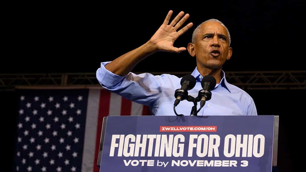 Barack Obama speaks at a campaign rally podium in Cleveland Public Auditorium.