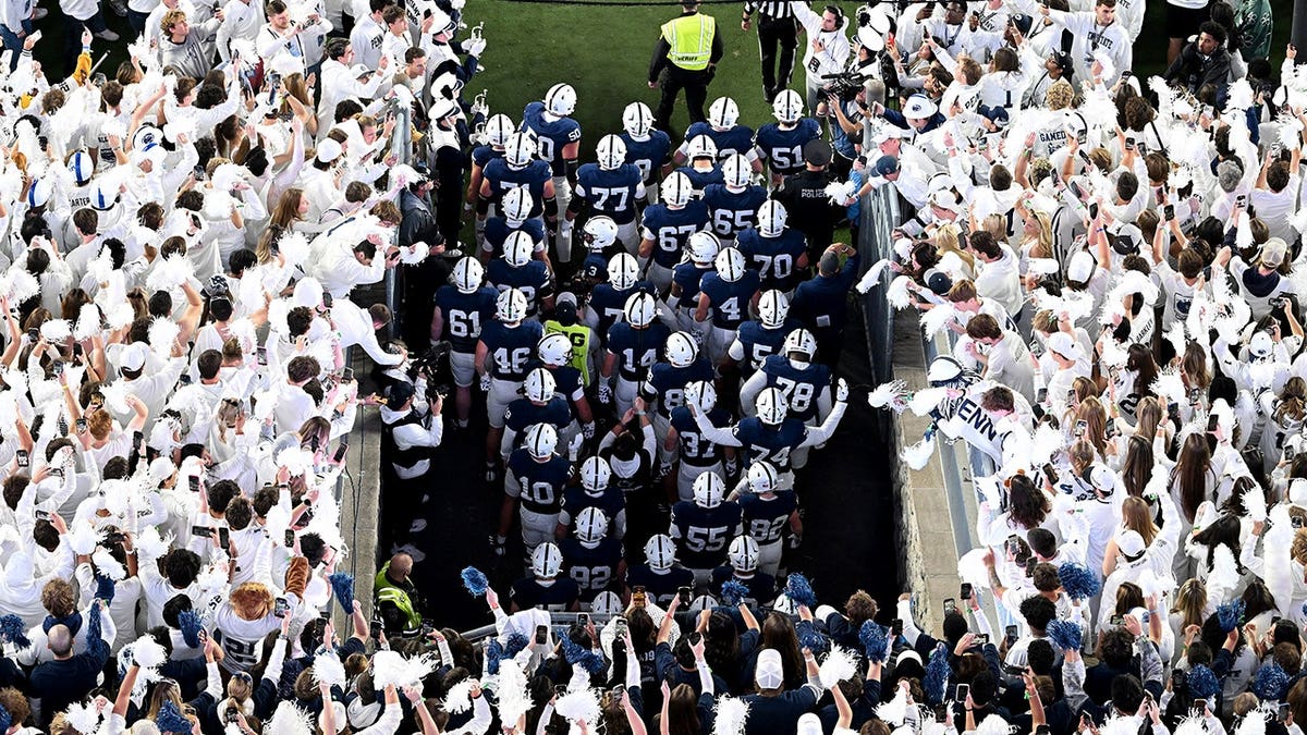 Penn State players prepare to take the field at Beaver Stadium during a whiteout.