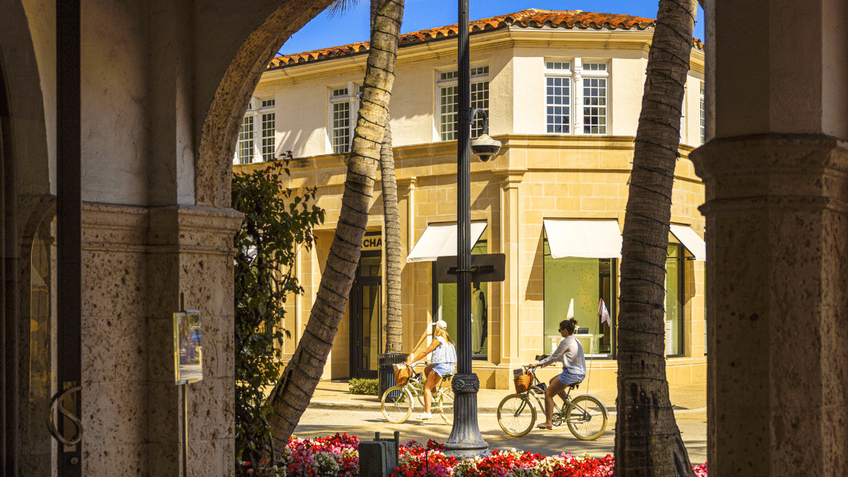 Cyclists travel on Worth Avenue in Palm Beach, Florida, on Saturday, April 5, 2025.