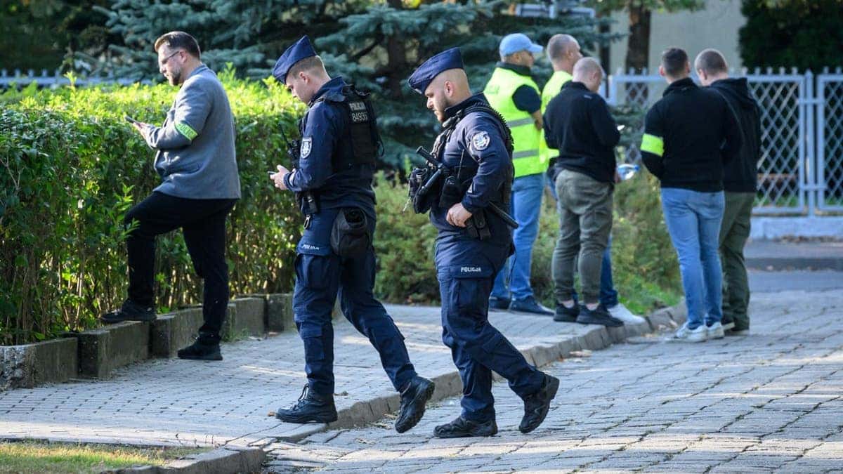 Forensic investigators work at the scene of a knife attack at a Polish vocational school