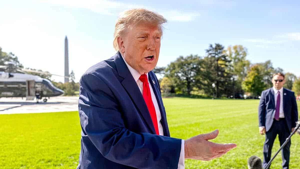 Donald Trump speaks to members of the media on the White House South Lawn.