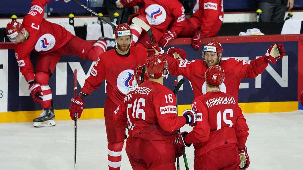 Russia players celebrate during an ice hockey match against Sweden.