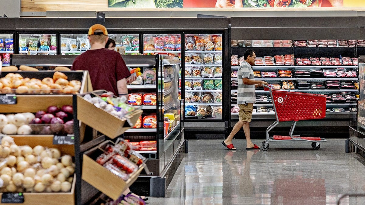 Customers shop for groceries at a Target store in Salt Lake City, Utah, US, on Friday, July 31, 2026. Target has been overhauling its grocery aisles since the spring, hoping the upscale Tarzhay success it once had with stylish apparel and home goods in the early 2000s can be revived in food. Photographer: Kim Raff/Bloomberg via Getty Images