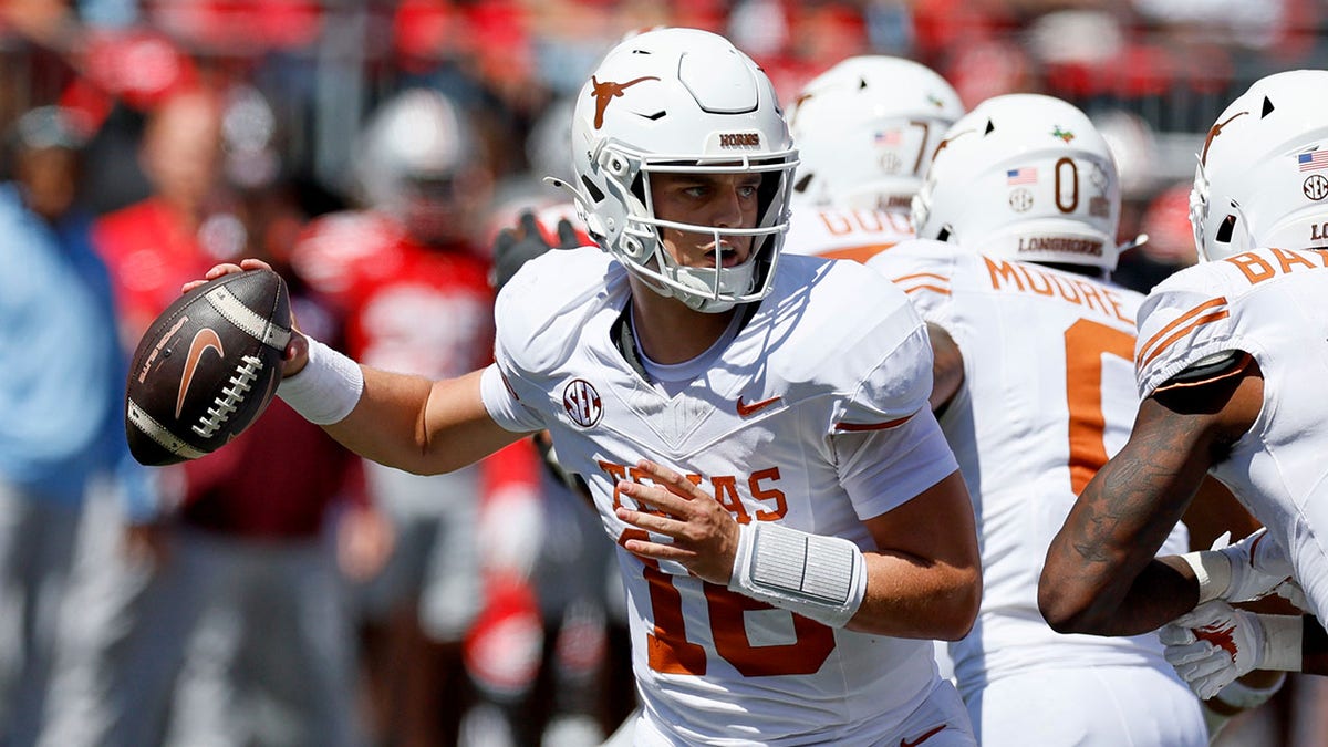 Texas quarterback Arch Manning drops back to pass against Ohio State during the first half of an NCAA college football game, Saturday, Aug. 30, 2025, in Columbus, Ohio.