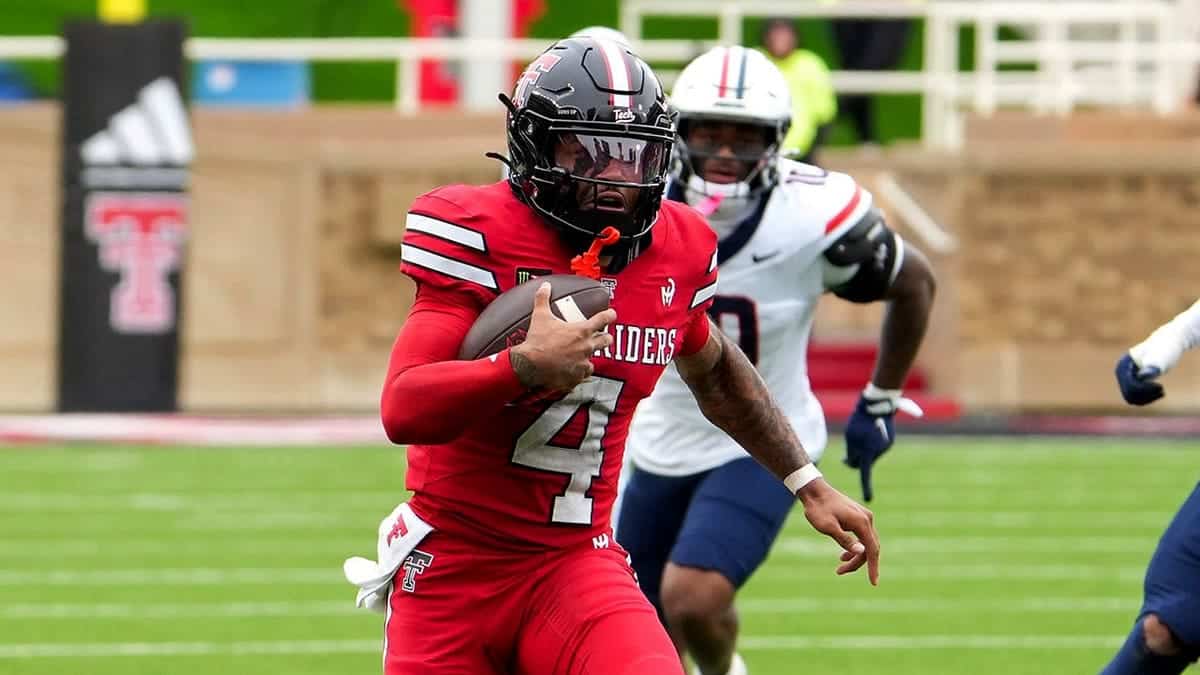 Thomas Castellanos runs with the ball during a Big 12 Conference football game.