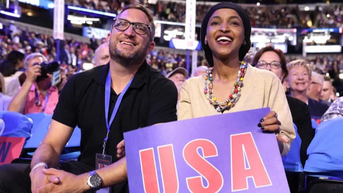 Ilhan Omar sits with husband Tim Mynett