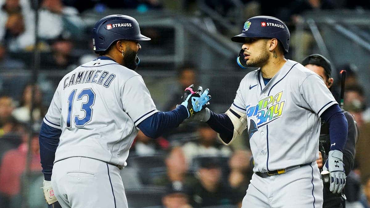 Victor Mesa Jr. and Junior Caminero celebrate after a two-run home run at Yankee Stadium.