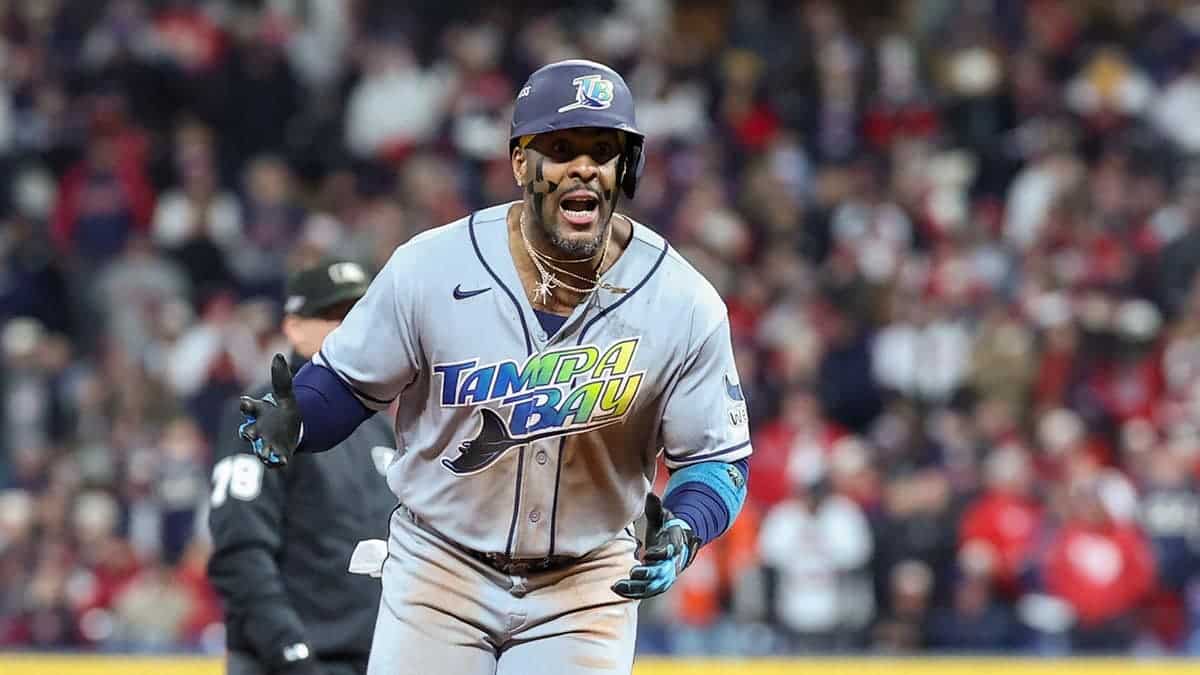 Yandy Díaz celebrates rounding the bases after hitting a home run at Progressive Field.